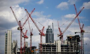 Construction Site Security Construction cranes workingConstruction cranes working on the Embassy Gardens luxury development in London on the Embassy Gardens luxury development in Battersea