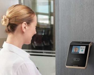 non-contact facial biometric reader installed on the wall near entrance